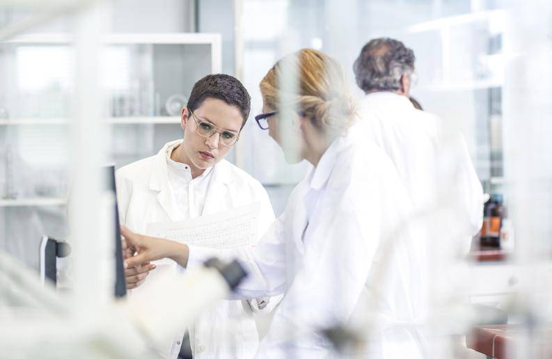 Stock images of scientists running a diagnostics test